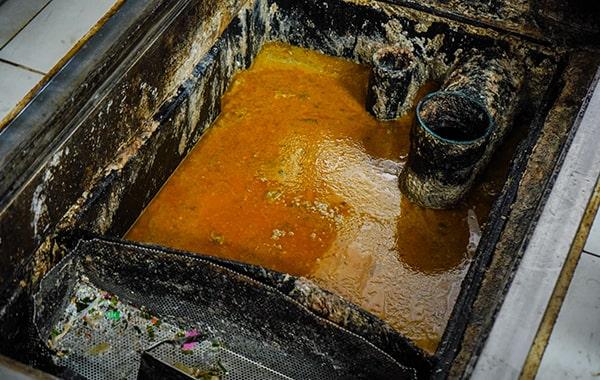 regular grease trap cleaning can help prevent plumbing concerns such as clogs and backups